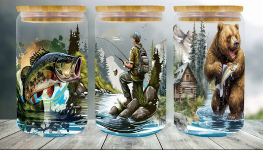 Three glass jars with nature-themed illustrations on a wooden surface.