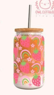 Pink tumbler with strawberry pattern and measurements on a white background