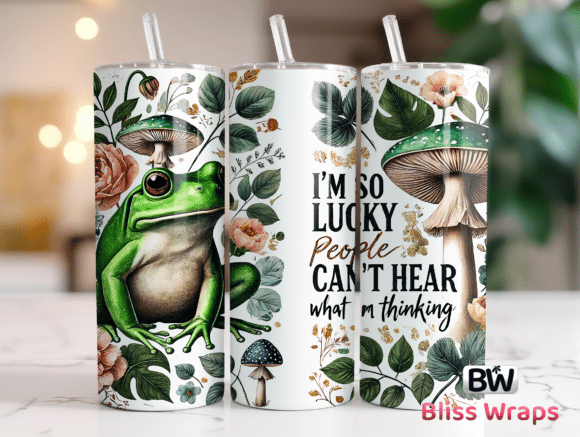 Three tumblers with nature-themed designs and text, featuring a frog, mushrooms, and floral elements.