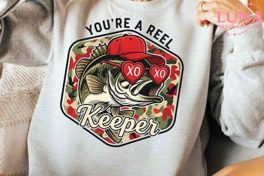 White sweatshirt with a graphic design featuring a fish, red hearts, and text on a neutral background.