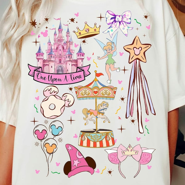 White t-shirt with colorful Disney-themed graphics including a castle, fairy, and carousel.