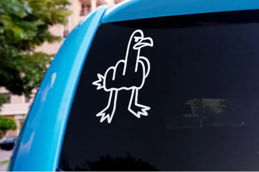 Car window with a white sticker of a cartoon rooster on a blue car.
